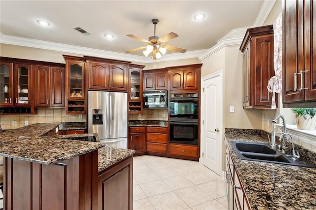 1045 Whitetail Dr, Mandeville, LA 70448 - kitchen with stainless steel appliances, a sink, ceiling fan, tasteful backsplash, and ornamental molding