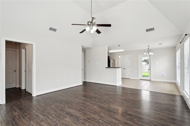 70363 10th St, Covington, LA 70433 - unfurnished living room with baseboards, ceiling fan with notable chandelier, wood finished floors, and visible vents