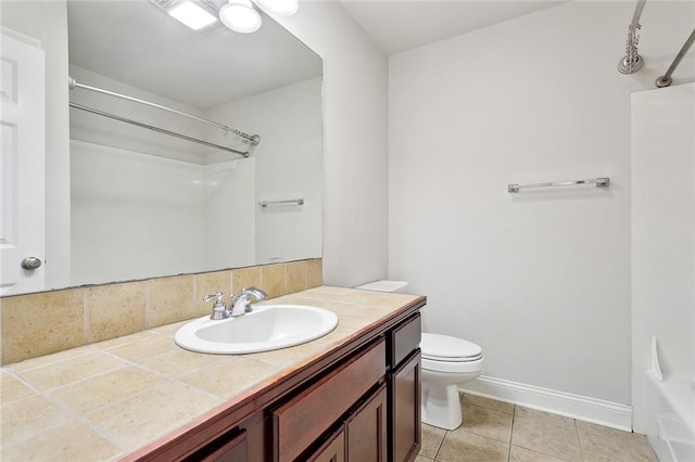 70363 10th St, Covington, LA 70433 - full bath featuring vanity, tile patterned flooring, baseboards, and toilet