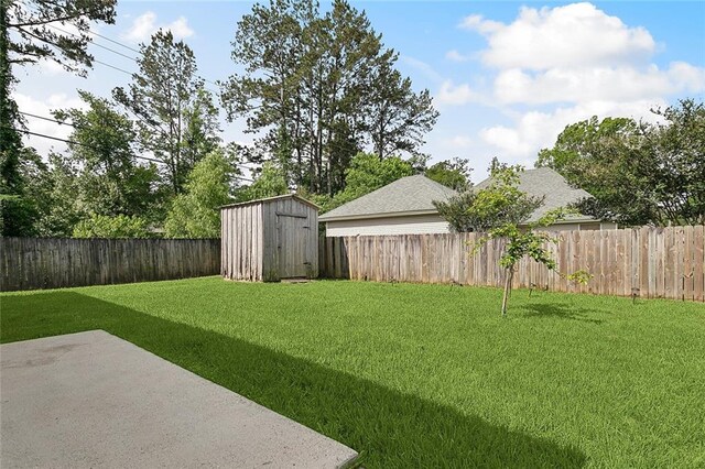 70363 10th St, Covington, LA 70433 - view of yard with an outdoor structure, a fenced backyard, a patio area, and a shed