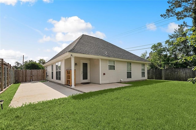 70363 10th St, Covington, LA 70433 - rear view of house with roof with shingles, a patio, a lawn, and a fenced backyard