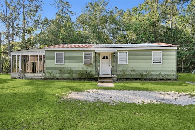 58420 Lynn Rd, Slidell, LA 70460 - manufactured / mobile home with a front lawn, a sunroom, and metal roof
