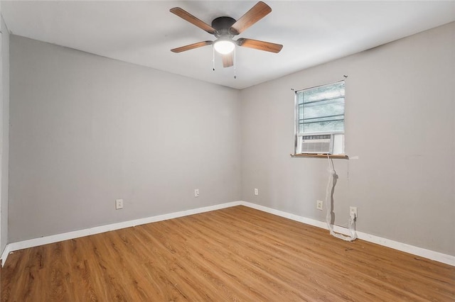 58420 Lynn Rd, Slidell, LA 70460 - spare room with light wood-style floors, baseboards, ceiling fan, and cooling unit