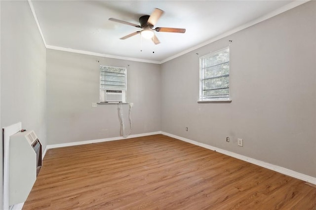 58420 Lynn Rd, Slidell, LA 70460 - unfurnished room featuring ceiling fan, crown molding, baseboards, light wood-style floors, and cooling unit