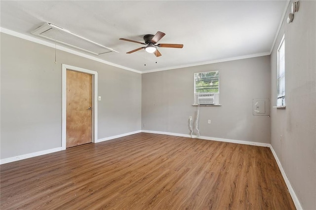 58420 Lynn Rd, Slidell, LA 70460 - unfurnished room featuring attic access, wood finished floors, baseboards, ceiling fan, and ornamental molding