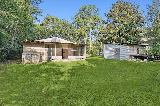 58420 Lynn Rd, Slidell, LA 70460 - view of grassy yard with a sunroom and an outdoor structure