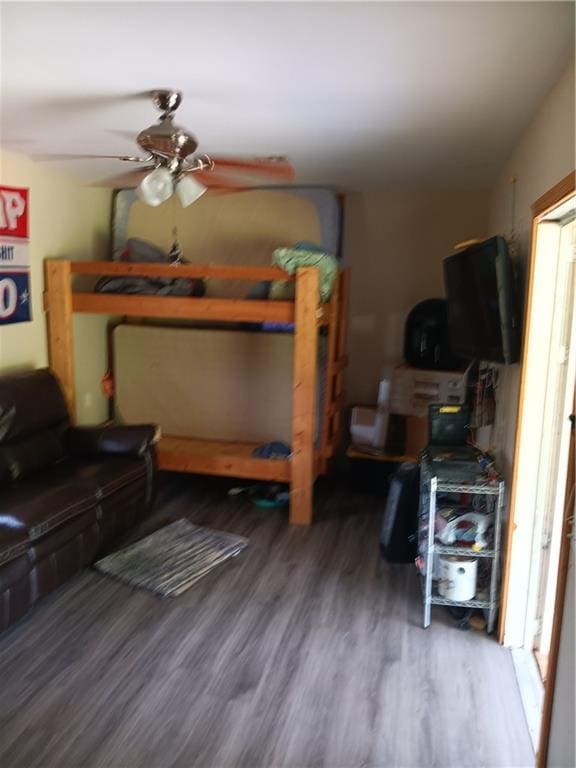 bedroom featuring ceiling fan and wood finished floors