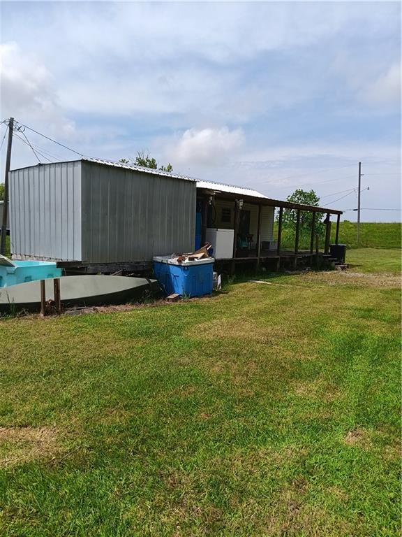 view of pole building with a lawn