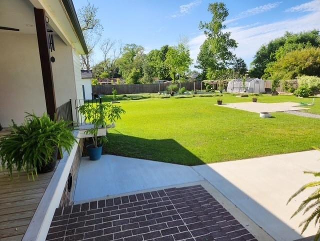 rear view of property featuring french doors, a patio, ceiling fan, and a yard