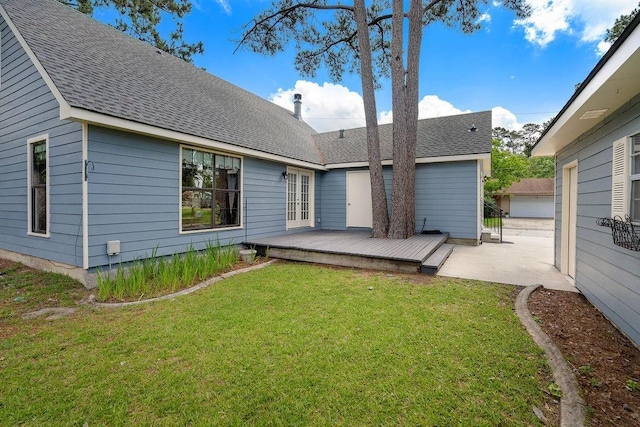 155 Greencrest Dr, Slidell, LA 70458 - rear view of house with a lawn, roof with shingles, a wooden deck, and a patio