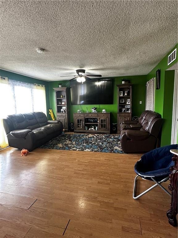 6320 Riverside Dr Unit 350, Metairie, LA 70003 - living room with a ceiling fan, visible vents, and wood finished floors