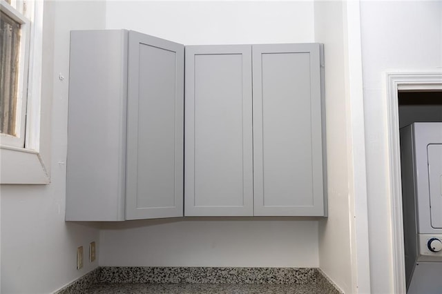 room details with stacked washing maching and dryer