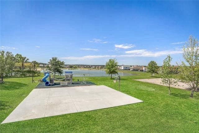 exterior space featuring a water view and a playground