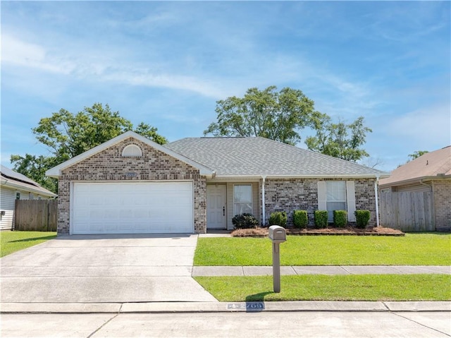 ranch-style home featuring brick siding, a garage, fence, and concrete driveway