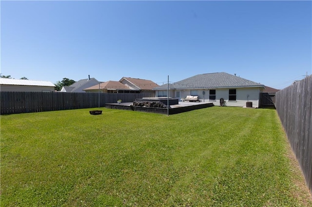 view of yard featuring a patio, a fenced backyard, and an outdoor fire pit