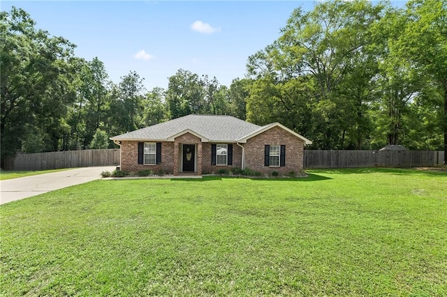 ranch-style home featuring a front lawn, fence, brick siding, a shingled roof, and concrete driveway