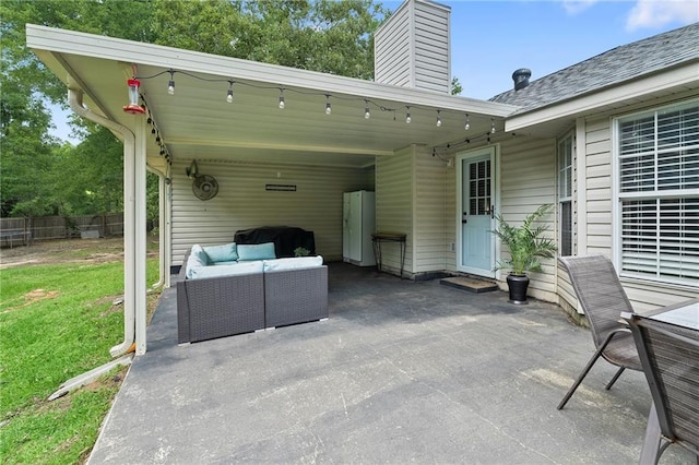 view of patio / terrace featuring fence and an outdoor hangout area