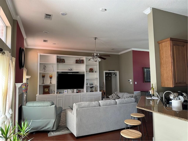205 Amanda Dr, Slidell, LA 70458 - living area with ceiling fan and ornamental molding