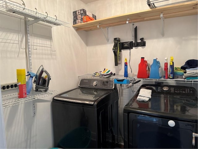 clothes washing area with independent washer and dryer