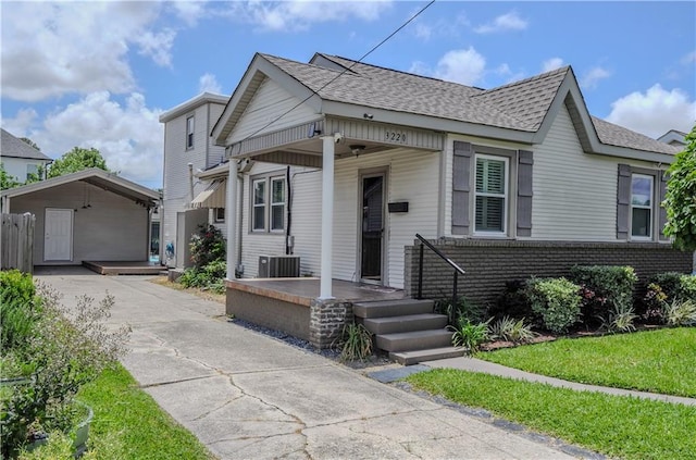 3220 48th St, Metairie, LA 70001 - bungalow-style house featuring roof with shingles, central AC, and concrete driveway