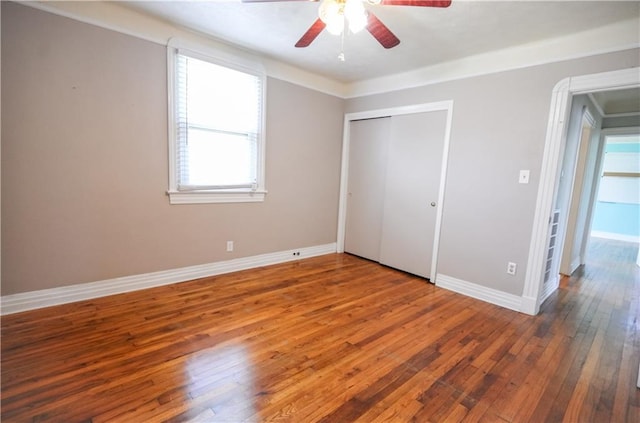 3220 48th St, Metairie, LA 70001 - unfurnished bedroom featuring baseboards, ceiling fan, a closet, and hardwood / wood-style flooring