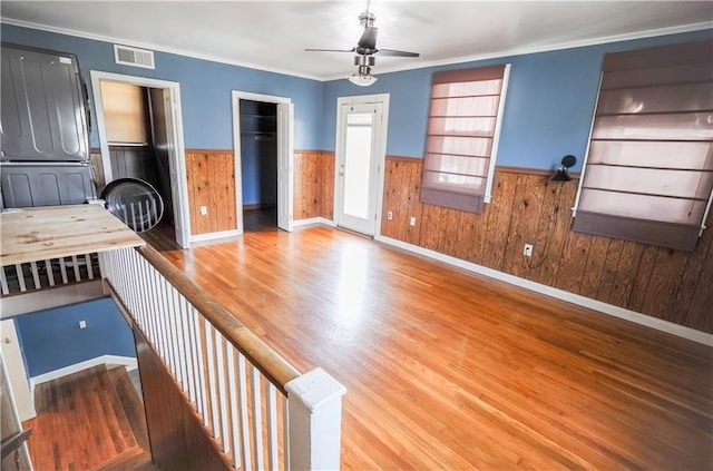 3220 48th St, Metairie, LA 70001 - unfurnished living room featuring visible vents, wainscoting, ceiling fan, and wood finished floors
