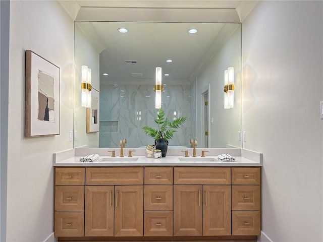 2412 Mississippi Ave, Metairie, LA 70003 - bathroom featuring a marble finish shower, double vanity, and recessed lighting