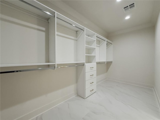 2412 Mississippi Ave, Metairie, LA 70003 - spacious closet featuring light marble finish floors
