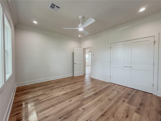 2412 Mississippi Ave, Metairie, LA 70003 - unfurnished bedroom with ornamental molding, light wood-style flooring, a closet, recessed lighting, and a ceiling fan