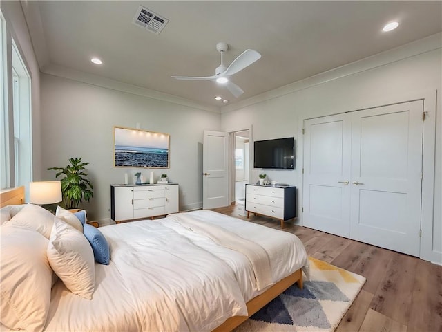 2412 Mississippi Ave, Metairie, LA 70003 - bedroom featuring crown molding, light wood-style flooring, recessed lighting, a closet, and a ceiling fan