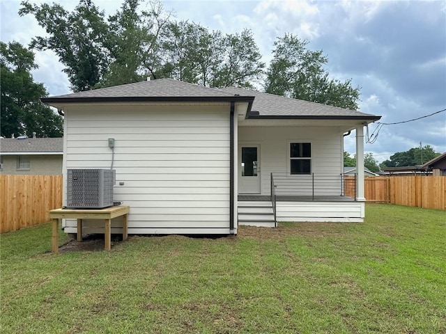 2412 Mississippi Ave, Metairie, LA 70003 - rear view of house featuring a fenced backyard and roof with shingles
