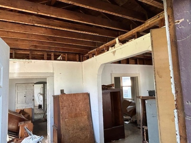 misc room featuring arched walkways