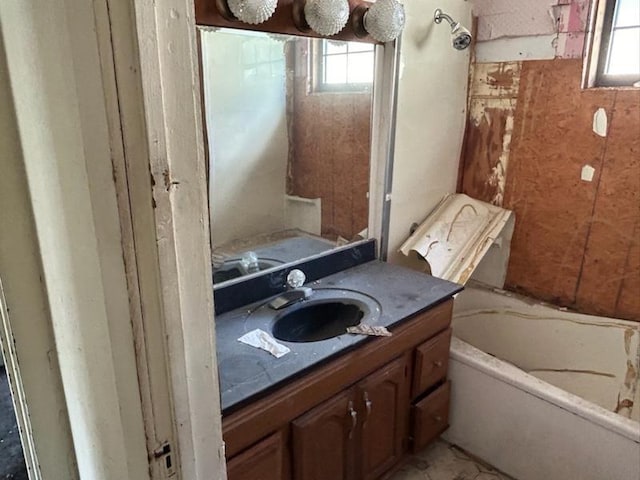 full bathroom with a bathtub and vanity