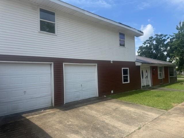 exterior space featuring an attached garage and concrete driveway