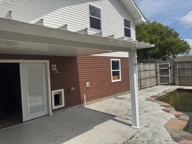 rear view of property with fence