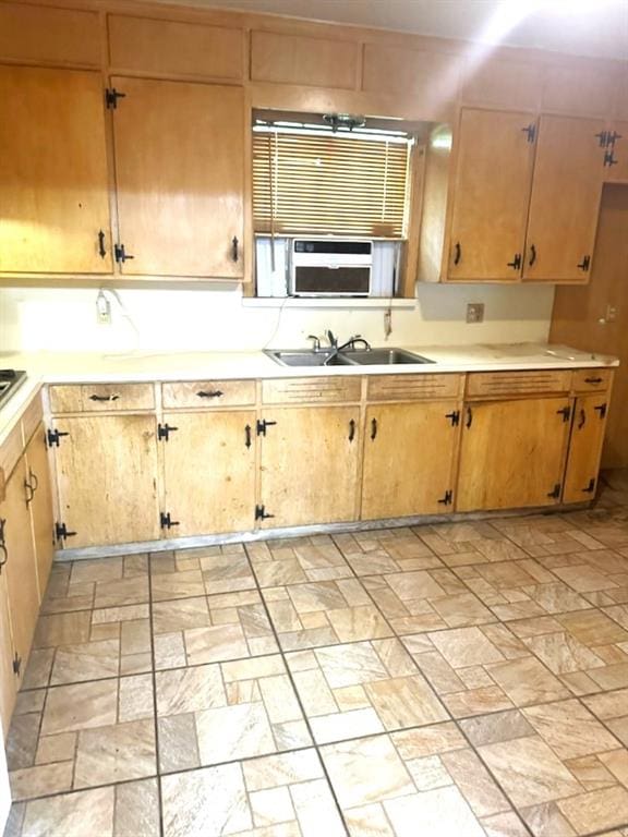 kitchen with light countertops and a sink