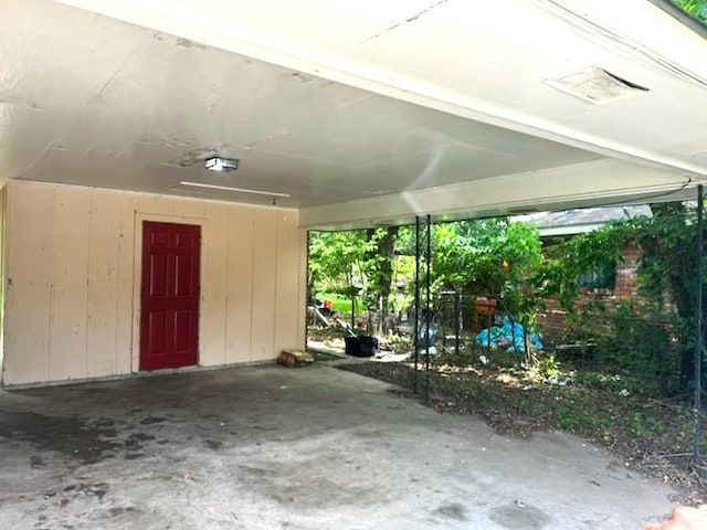 view of parking / parking lot with a carport