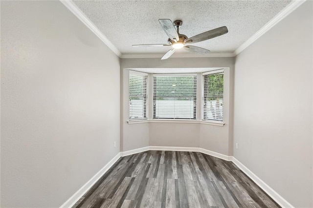 unfurnished room with dark wood-type flooring, a ceiling fan, a textured ceiling, and crown molding