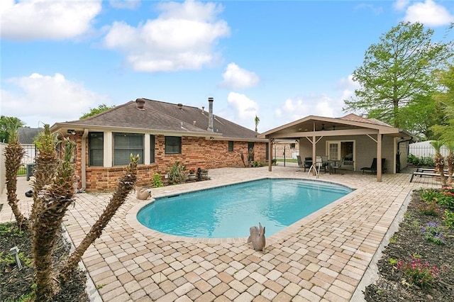 view of pool featuring a patio, fence, and a fenced in pool