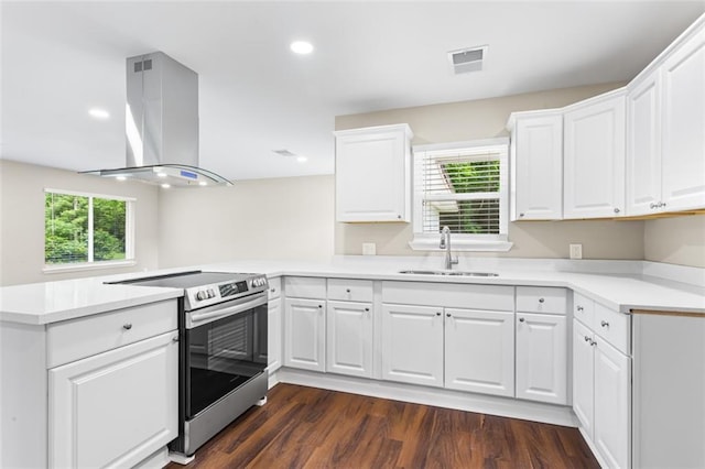 6815 Calumet St, Baton Rouge, LA 70805 - kitchen featuring a sink, light countertops, electric stove, a peninsula, and island range hood