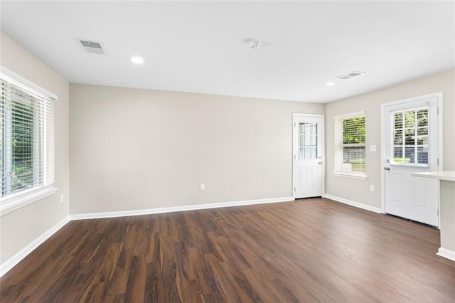 6815 Calumet St, Baton Rouge, LA 70805 - unfurnished room featuring recessed lighting, baseboards, dark wood-style flooring, and visible vents