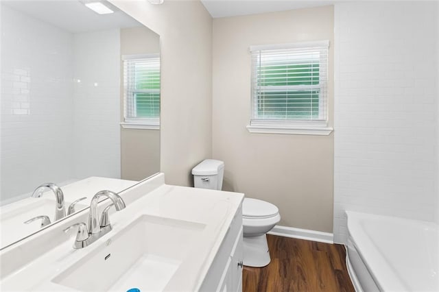 6815 Calumet St, Baton Rouge, LA 70805 - bathroom featuring vanity, baseboards, toilet, and wood finished floors