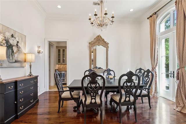 dining room with crown molding, recessed lighting, dark wood finished floors, and a chandelier