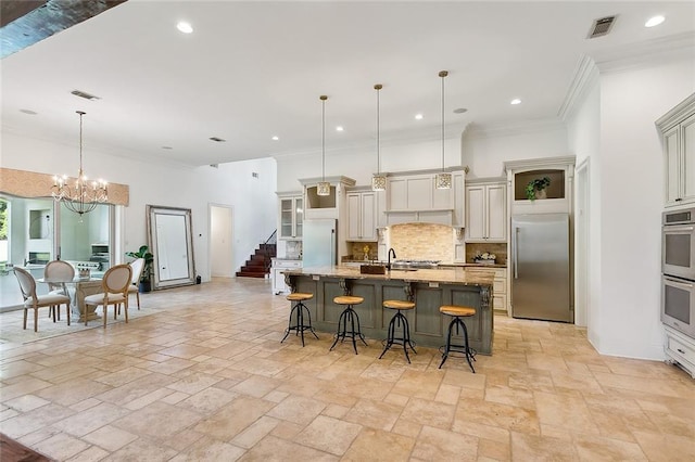 kitchen featuring crown molding, stainless steel appliances, a breakfast bar, and decorative backsplash