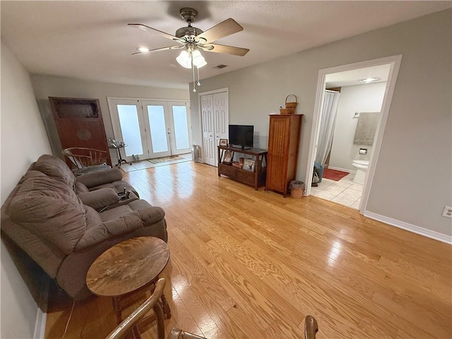 308 Ormond Meadows Dr Unit B, Destrehan, LA 70047 - living area with baseboards, ceiling fan, light wood-type flooring, and visible vents