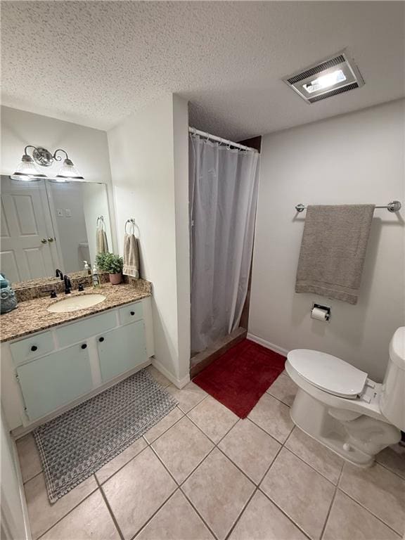 308 Ormond Meadows Dr Unit B, Destrehan, LA 70047 - bathroom with visible vents, a textured ceiling, toilet, and vanity
