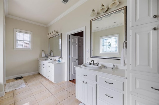 609 W Dakota St, Hammond, LA 70401 - bathroom with plenty of natural light, ornamental molding, a sink, and two vanities