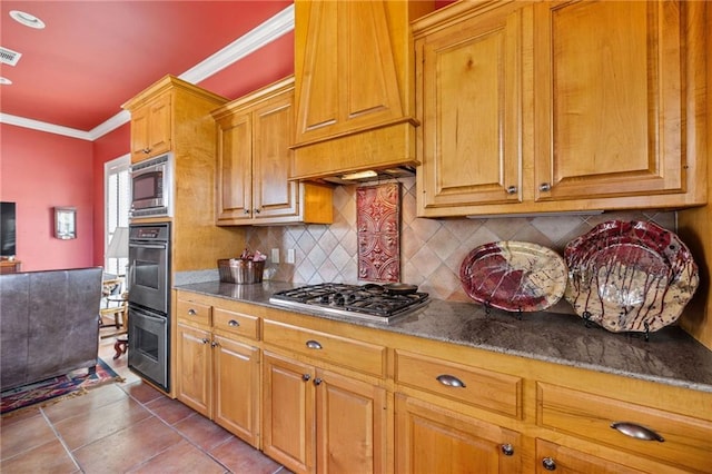 609 W Dakota St, Hammond, LA 70401 - kitchen with crown molding, brown cabinetry, visible vents, tasteful backsplash, and appliances with stainless steel finishes