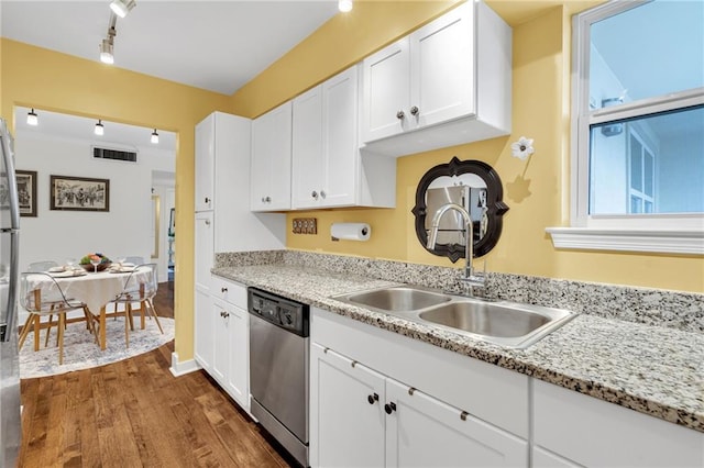 kitchen with dark wood-style flooring, appliances with stainless steel finishes, a sink, rail lighting, and visible vents