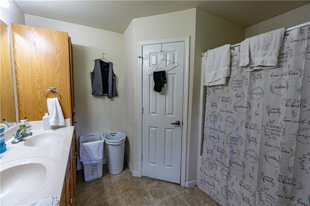 11257 Abbey Ln, Denham Springs, LA 70726 - bathroom featuring double vanity, a shower with curtain, a sink, and tile patterned flooring
